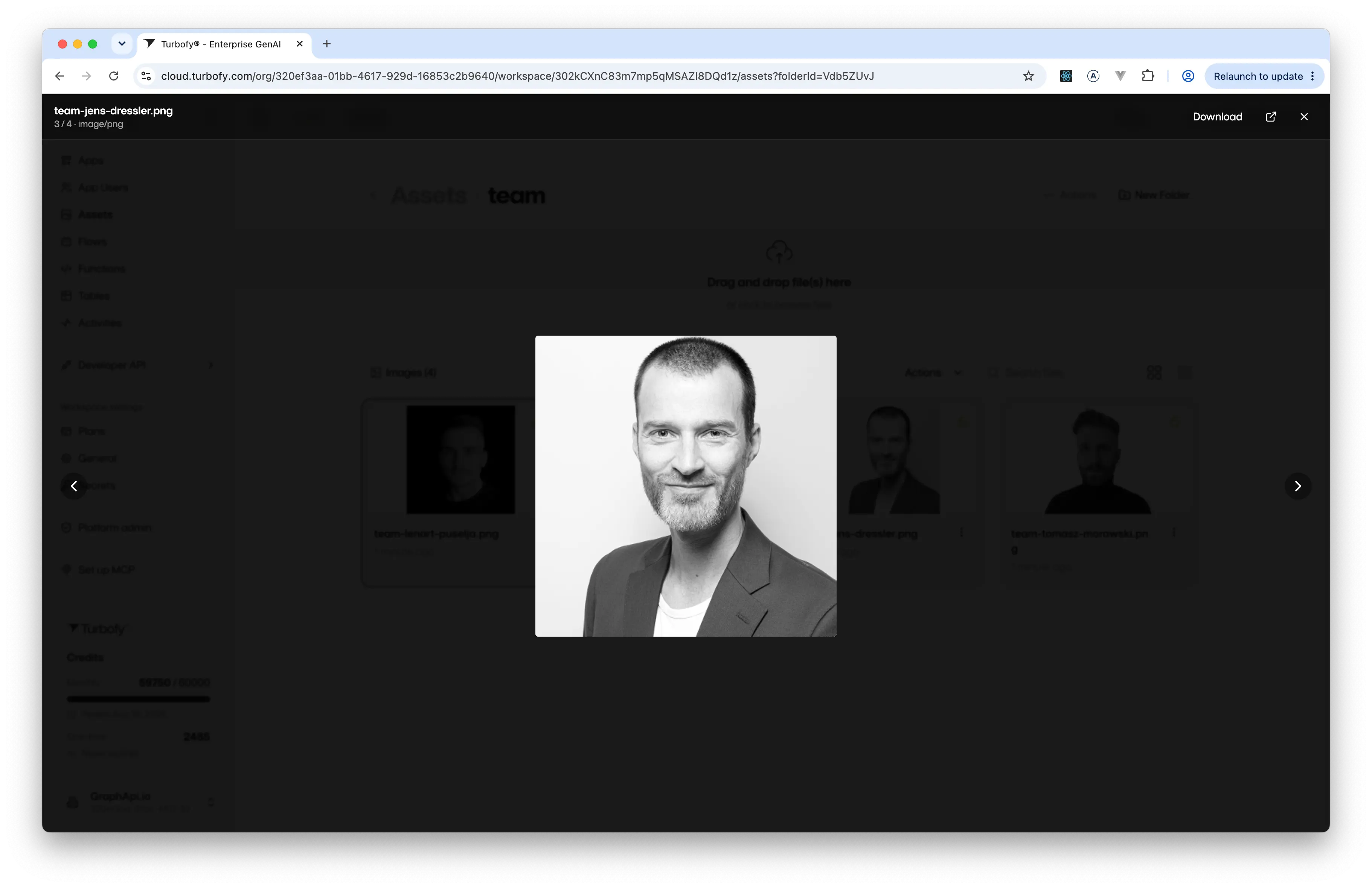 An image open in the full-screen lightbox, with the file name and counter top-left and Download, open-in-new-tab and close controls top-right